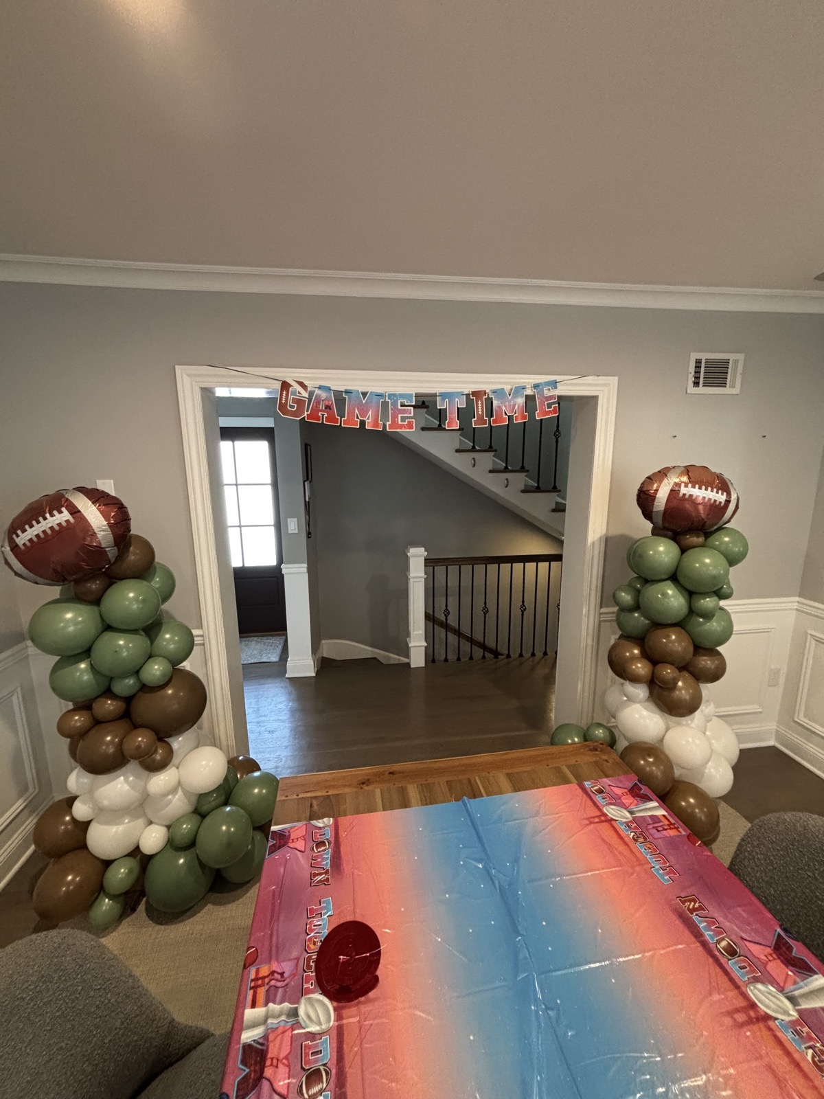 Game-day themed sage balloon columns